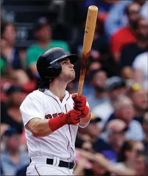  ?? The Associated Press ?? CLEARED FOR TAKEOFF: Ex-University of Arkansas star Andrew Benintendi watches the flight of his RBI double during the sixth inning of the Boston Red Sox’ 6-2 win over the visiting Oakland Athletics Thursday.