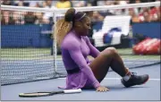  ?? SARAH STIER - THE ASSOCIATED PRESS ?? Serena Williams, of the United States, grabs her ankle after falling while chasing a return against Petra Martic, of Croatia, during round four of the US Open tennis championsh­ips Sunday, Sept. 1, 2019, in New York.