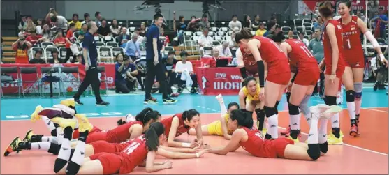  ?? PHOTOS BY XINHUA ?? Team China players celebrate beating Argentina on Sept 29 to complete an 11-match clean sweep at the FIVB Women’s Volleyball World Cup in Japan. China had wrapped up the title the previous day with victory over Serbia at the same venue in Osaka.