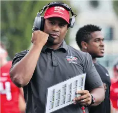  ?? BRAD McLEOD/SFU ATHLETICS ?? SFU Clan football coach Thomas Ford works on the sidelines at Terry Fox Field on Saturday, when the team ended a 33-game losing streak with a 54-7 win over the Willamette Bearcats.