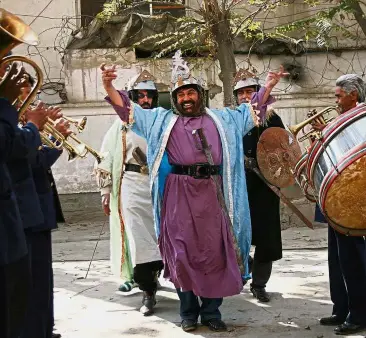  ?? — AFP ?? Best medicine: (From left) Fakhri, Hamgam and Nasrat Haidari in a scene from ‘ Zang Khatar’.