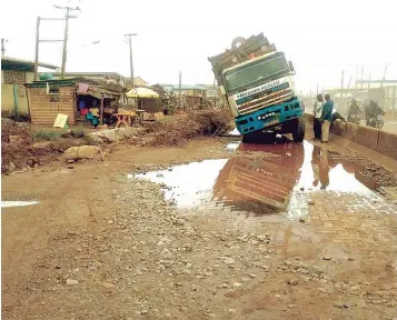  ?? ?? Nigerians bid for better living conditions is being hampered by the deplorable state of roads