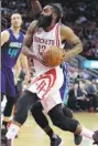  ?? ERIK WILLIAMS / USA TODAY SPORTS ?? Houston Rockets’ James Harden drives to the basket for a layup against the Charlotte Hornets on Tuesday.
