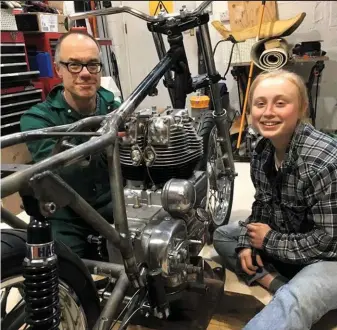  ??  ?? It’s all hands to the pumps as Rupe ropes in his niece Lydia to help install the engine in the Enfield