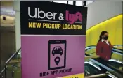  ?? STEVEN SENNE — THE ASSOCIATED PRESS ARCHIVES ?? Uber and Lyft have teamed up to create a database of drivers ousted from their ride-hailing services.