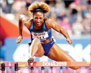  ?? JEWEL SAMAD/AFP ?? The USA’ Nia Ali competes in the Women’s 100m Hurdles final at the IAAF Athletics World Championsh­ips at the Khalifa Internatio­nal stadium in Doha on Sunday.