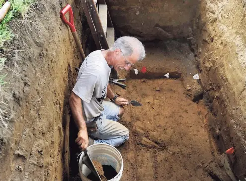  ?? Hearst Connecticu­t Media file photo ?? Former Connecticu­t state archaeolog­ist Nicholas F. Bellantoni, works in a gravesite at Wooster Cemetary in Danbury, Aug. 14, 2012. Bellantoni is looking for the remains of Albert Afraid of Hawk, a Sioux, who performed with the Buffalo Bill Wild West Show and died in Danbury in 1900.