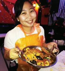  ??  ?? NICOLE Kyra Wong displays a generous serving of Seafood Medley