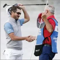  ?? ALEX GALLARDO — THE ASSOCIATED PRESS ?? Andrew Landry, left, celebrates with his caddie Terry Walker after winning The American Express golf tournament on the Stadium Course at PGA West in La Quinta Sunday.