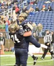  ?? PAUL DICICCO — FOR THE NEWS-HERALD ?? Kirtland’s Luke Gardner celebrates a touchdown with Jack Bailey on Nov. 30 during the Division VI state final against Maria Stein Marion Local in Canton. The Hornets won, 16-7.