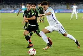  ?? — AP ?? England’s Jadon Sancho (right) in action against Mexico in their Group F match in Kolkata on Wednesday. England won 3-2.