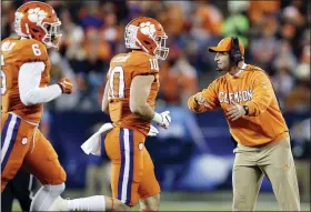  ?? GERRY BROOME — THE ASSOCIATED PRESS ?? Clemson head coach Dabo Swinney directs his players during the first half of the Atlantic Coast Conference championsh­ip NCAA college football game against Virginia in Charlotte, N.C., Saturday.