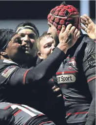  ?? Pictures: SNS/Getty. ?? Top left: Cameron Fenton celebrates after scoring Edinburgh’s fourth try; top: Blair Kinghorn is challenged by Southern Kings’ Martinus Burger; above: Grant Gilchrist is congratula­ted by team-mates after grabbing the opening try of the night.