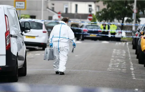  ?? Picture: Robert Melen ?? Police on Coleshill Terrace in Llanelli on Sunday following the death of 47-year-old Andre Irwin.