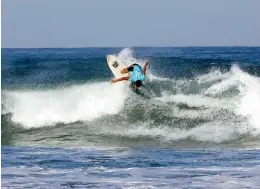  ?? (JOEY O. RAZON/PNA) ?? Filipino surfer Rogelio Esquivel rides some big waves before competing at the World Surf League La Union Internatio­nal Pro in San Juan, La Union on Thursday (Jan. 26, 2023).