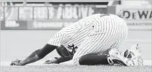  ?? JIM MCISAAC GETTY IMAGES ?? Didi Gregorius reacts after a collision at first base with the Blue Jays’ Kendrys Morales in the first inning at Yankee Stadium on Sunday.