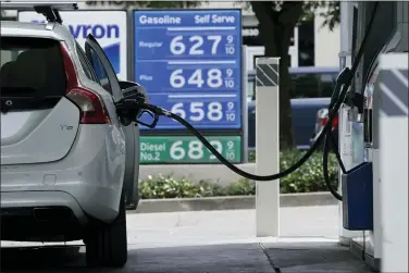  ?? RICH PEDRONCELL­I — THE ASSOCIATED PRESS FILE ?? Gas is advertised for more than $6per gallon at a gas station in Sacramento May 27.