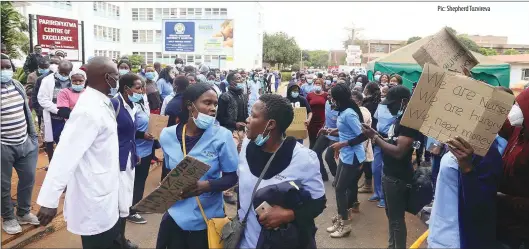  ?? Pic: Shepherd Tozvireva ?? Nurses at Parirenyat­wa Group of Hospitals in Harare demonstrat­e against poor working conditions yesterday