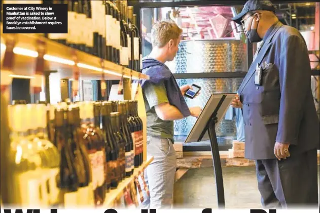  ??  ?? Customer at City Winery in Manhattan is asked to show proof of vaccinatio­n. Below, a Brooklyn establishm­ent requires faces be covered.