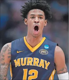  ?? JESSICA HILL/AP PHOTO ?? Murray State’s Ja Morant had a triple-double — 17 points, 16 assists, 11 rebounds — to lead the Racers to a 83-64 win over Marquette on Thursday in the NCAA tournament at the XL Center in Hartford.