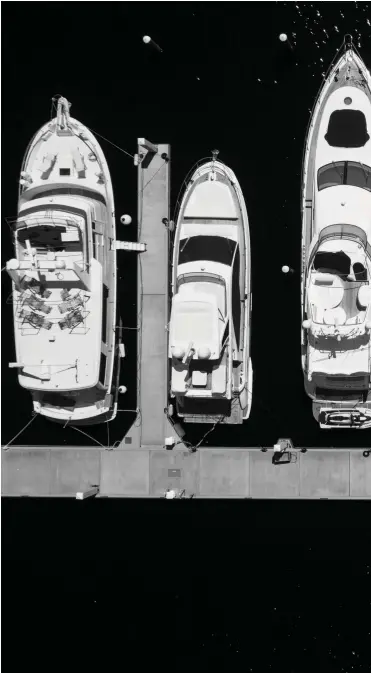  ??  ?? The Beneteau 44 NautiGator (bottom right) approaches a dock at Tarpon Point Marina.