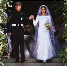  ?? FOTO: BEN STANSALL/DPA ?? Zwei Jahre nach der Hochzeit leben Prinz Harry und Meghan in den USA - er hat alles hinter sich gelassen, sie ist zurück in ihrer Heimat. Viele blicken mit gemischten Gefühlen auf die Heirat zurück.