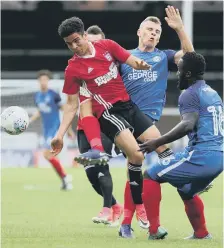  ??  ?? Harry Anderson (centre) in the thick of the action against Ipswich.