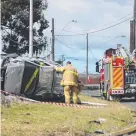  ??  ?? A car rolled over near the corner of Melbourne Rd and Separation St.