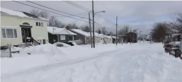  ??  ?? Snow-bound St. John’s. Howley Avenue Extension is shown exactly one year ago.