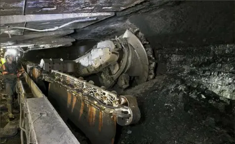  ?? Consol Energy Inc. ?? A machine cuts slabs of coal inside Consol Energy’s Bailey Mine in southweste­rn Pennsylvan­ia.