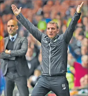  ??  ?? CALLING THE SHOTS: Brendan Rodgers issues instructio­ns on the touchline while Pep Guardiola looks on.