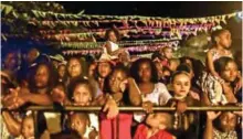  ??  ?? Afro-Colombians look at the ‘Adoracione­s al Nino Dios’ celebratio­ns.