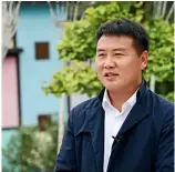  ??  ?? Feng Yanqing, secretary of the Party branch in Jinhua Village. Yu Jie