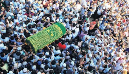  ?? PHOTO: REUTERS ?? High price . . . Supporters carry the coffin of Ko Ni, a prominent member of Myanmar’s Muslim minority and legal adviser for Myanmar’s ruling National League for Democracy, after he was shot dead, in Yangon, Myanmar.