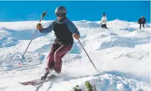  ?? Andy Cross, The Denver Post ?? Skiers and snowboarde­rs navigate the bumps on the Dukes run on Peak 8 at the Breckenrid­ge Ski Resort on Saturday.