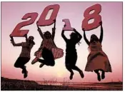  ?? SANJEEV GUPTA/EPA-EFE ?? Youths pose for a New Year’s photo in Bhopal, India. Celebratio­ns around the world heralded the beginning of 2018.