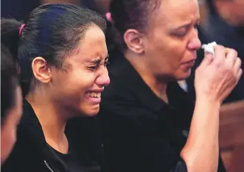  ?? AP ?? Relatives of killed Coptic Christians grieve during the funeral service at Church of Great Martyr Prince Tadros, in Minya yesterday. Seven bus passengers were killed by gunmen on Thursday.