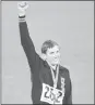  ?? FILE — THE ASSOCIATED PRESS ?? Gold medal winner Dick Fosbury raises his arm on the victor's podium of the Olympic stadium, Oct. 20, 1968, in Mexico City.