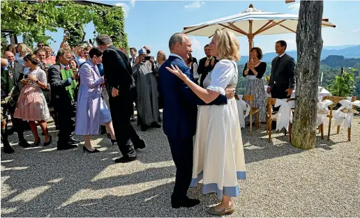  ?? AP ?? Russian President Vladimir Putin dances with Austrian Foreign Minister Karin Kneissl as he attends her wedding to Austrian businessma­n Wolfgang Meilinger in Gamlitz, southern Austria.
