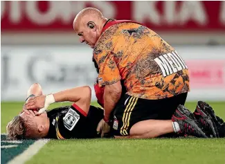  ?? PHOTO: PHOTOSPORT ?? Chiefs first five-eighth Damian McKenzie was down but not out during his team’s thrilling 27-21 against the Blues in Auckland last night.