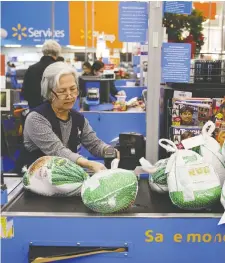  ?? PATRICK T. FALLON/BLOOMBERG ?? Walmart plans to hire 10,000 people to ensure it stays open and keeps up with demand amid the COVID-19 crisis.