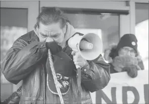  ?? CP PHOTO ?? Walter Red Thunder, left, from Red Pheasant First Nation, gets emotional during a rally in Regina following the not guilty verdict in the Gerald Stanley trial.