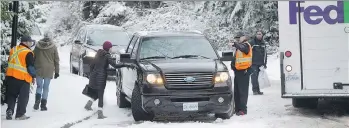  ?? THE CANADIAN PRESS FILES ?? Driving in the snow is no easy feat and accidents can happen. Know how to use your vehicle and all of its features — including climate control and anti-braking systems — during winter driving.