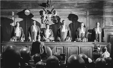  ??  ?? Maraga (third right) and judges stand prior to speaking as the Supreme Court dismissed two petitions to overturn the country’s Oct 26 presidenti­al election re-run, validating the poll victory of Kenyatta. — AFP photo