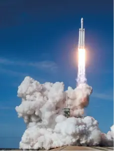  ?? AP PHOTO ?? A Falcon 9 SpaceX heavy rocket lifts off at Kennedy Space Center in Cape Canaveral, Fla., on Tuesday.