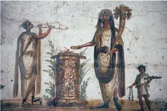  ??  ?? A fresco showing lares, or local household gods, from a shrine in Pompeii, circa first century AD