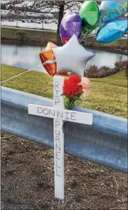  ?? PHOTOS BY TOM KELLY III — DIGITAL FIRST MEDIA ?? A cross marks the spot on Route 100 in Pottstown where Donnie Purnell was struck and killed March 3 by an alleged hit-and-run driver.