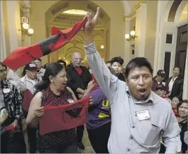  ?? Rich Pedroncell­i Associated Press ?? FARMWORKER­S and their supporters rally outside the office of Assembly Speaker Anthony Rendon after the Assembly failed to vote on an overtime bill.