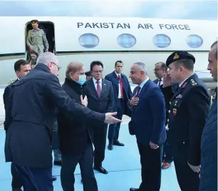  ?? — APP ?? Prime Minister Shehbaz Sharif is greeted by Turkish officials on his arrival in Istanbul for a two-day official visit on Friday.