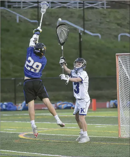  ?? PETE BANNAN — MEDIANEWS GROUP ?? Kennett goalie Jason Astle (13) clears the ball as Downingtow­n East’s Alystair Hemburger blocks him.